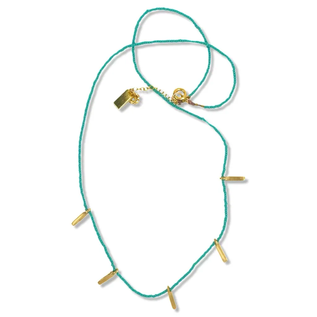 FRINGE NECKLACE IN GOLD ON TURQUOISE BEADS