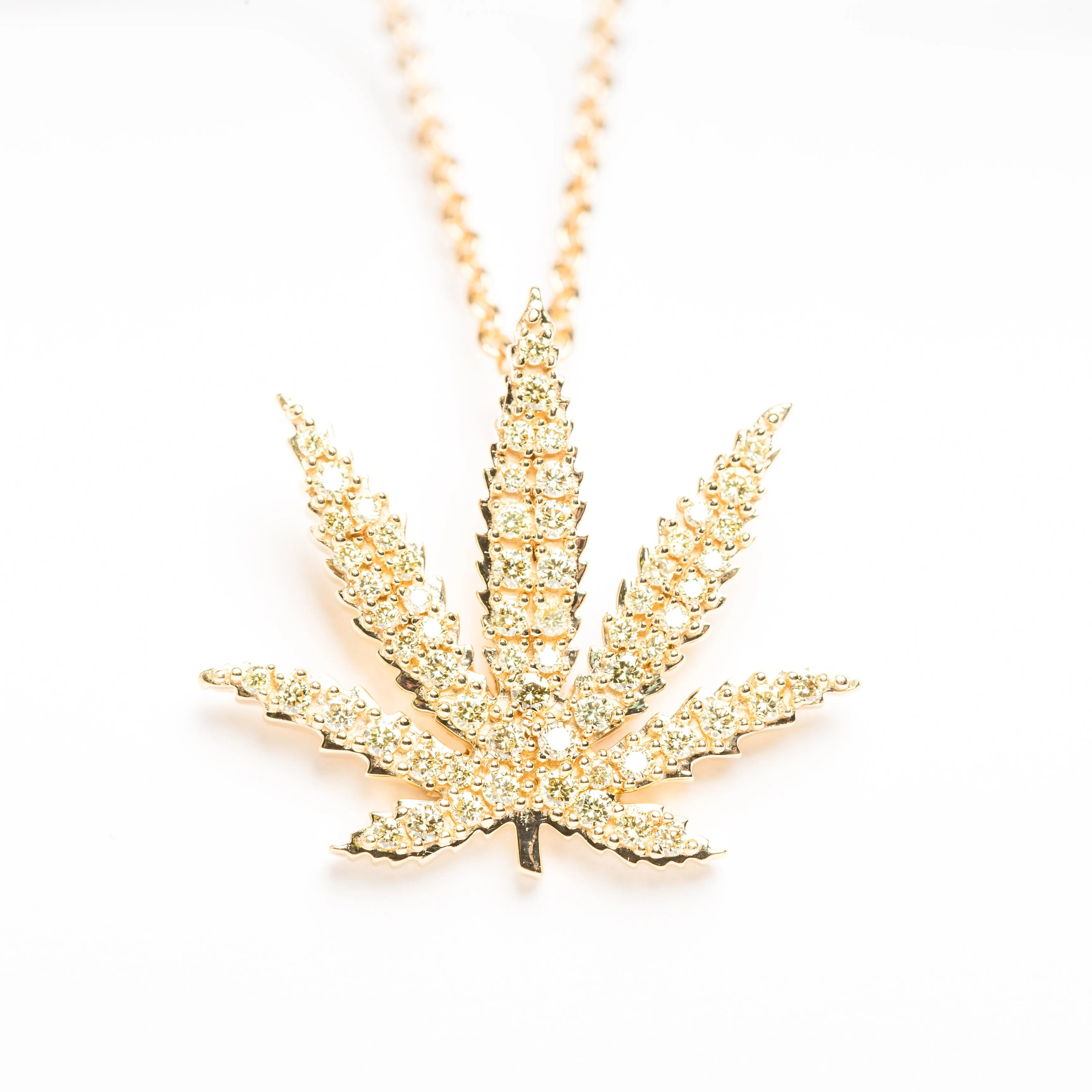 Gold Sativa Leaf Pendant with Yellow Diamond Gemstones