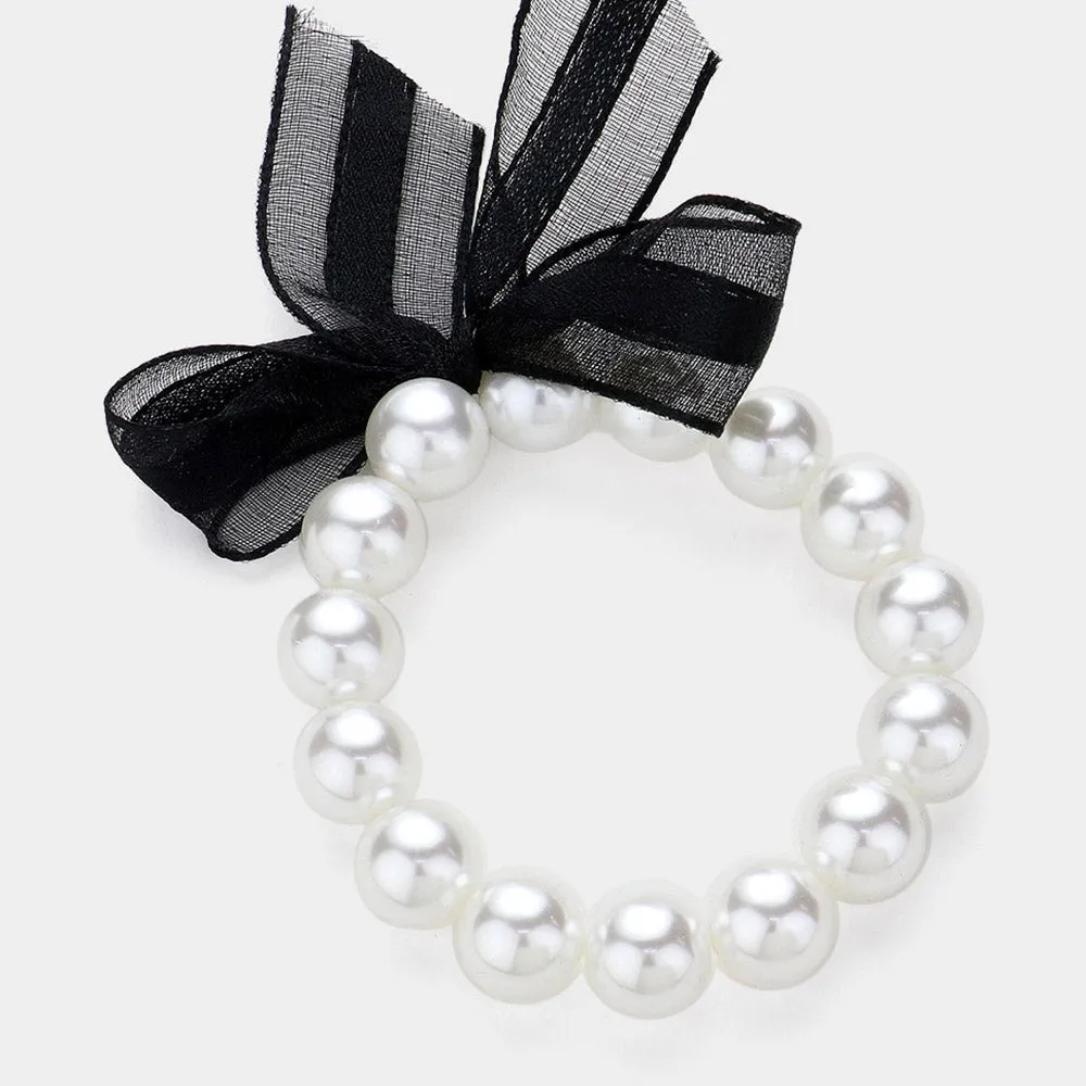 iLLASPARKZ Bow Pointed Pearl Stretch Bracelet